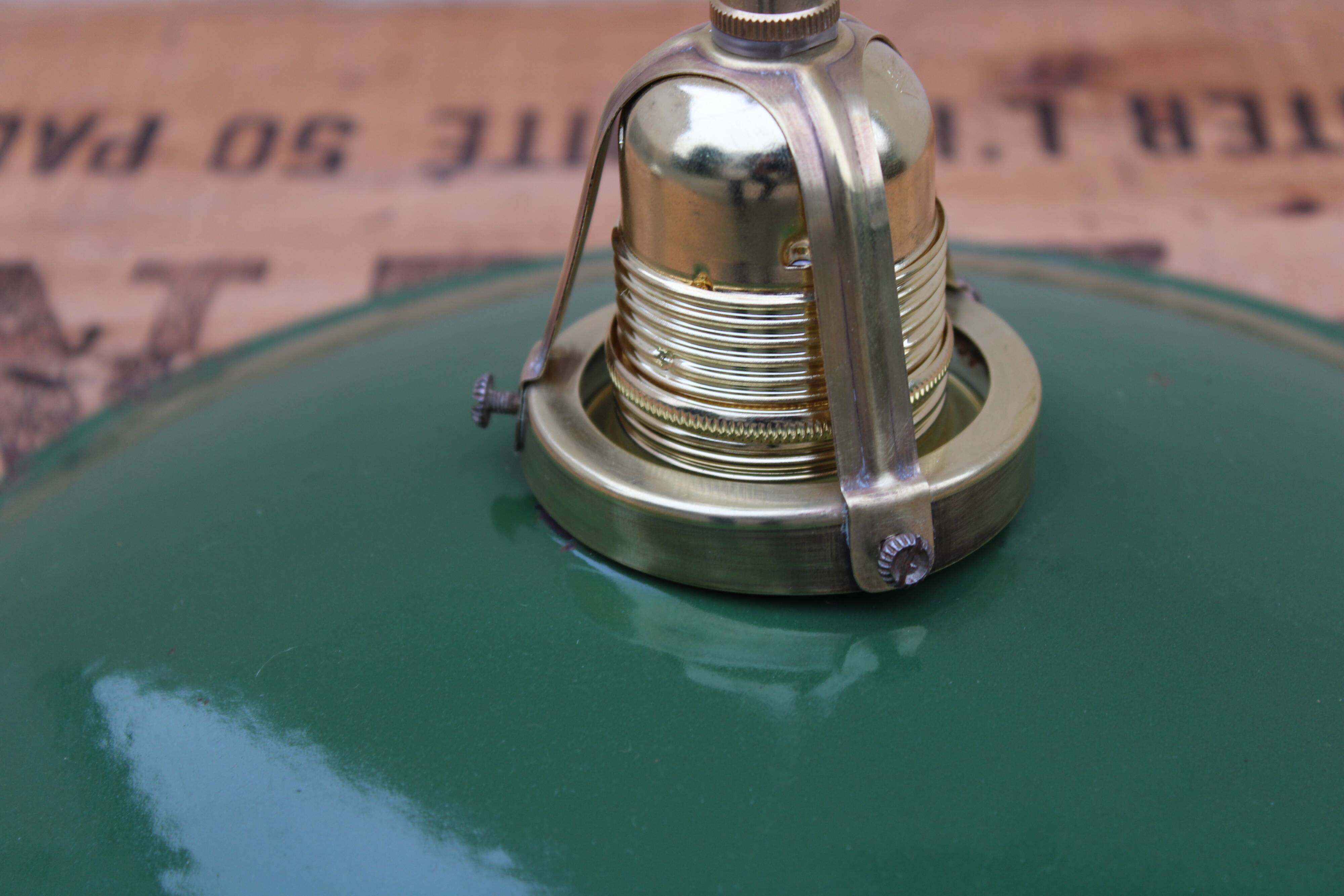 Hanging in green enamelled sheet metal