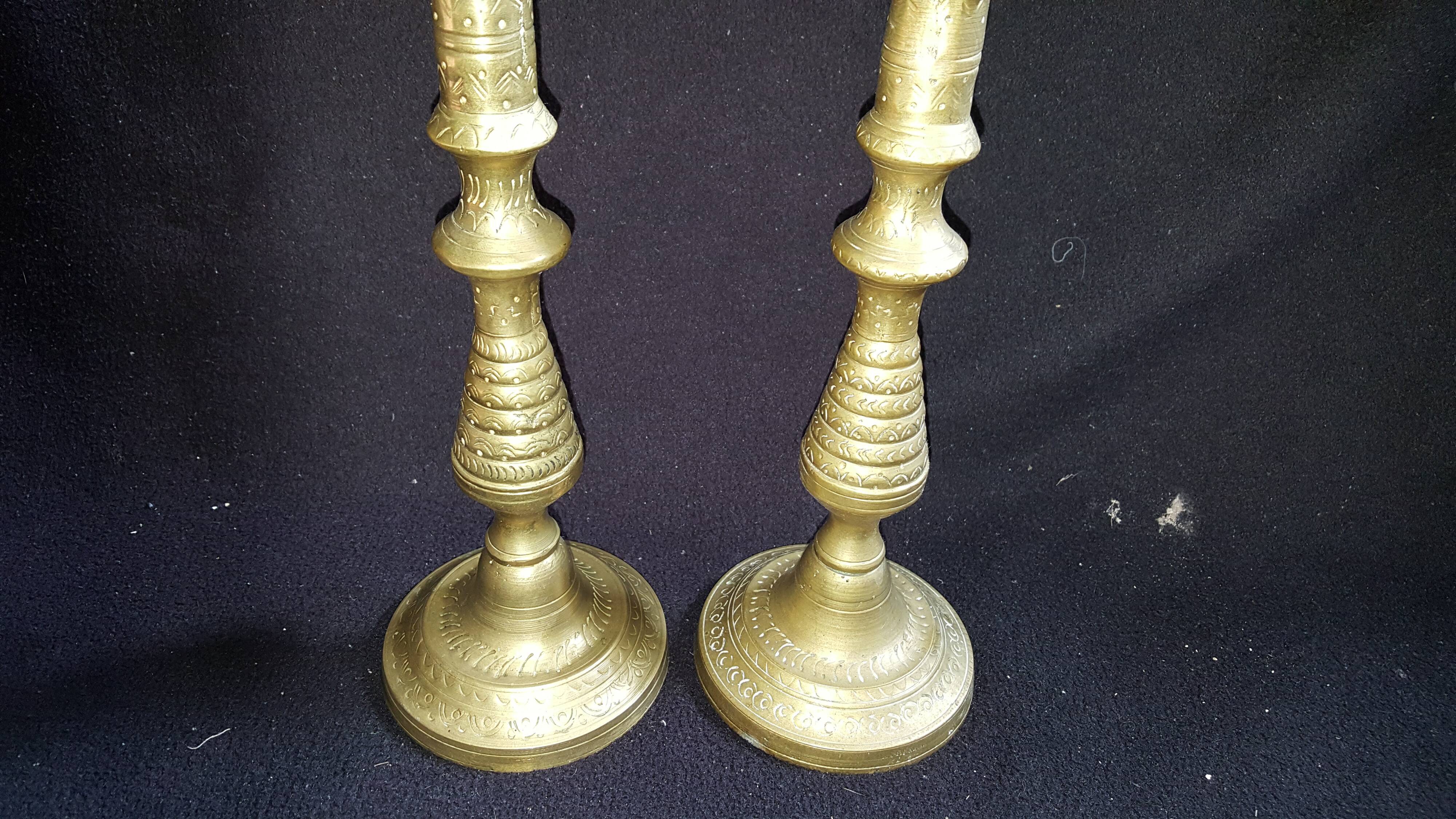 Former pair of bronze candlesticks