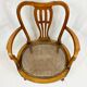 Fauteuil bas anglais en bois ajouré à assise cannée, 19e siècle