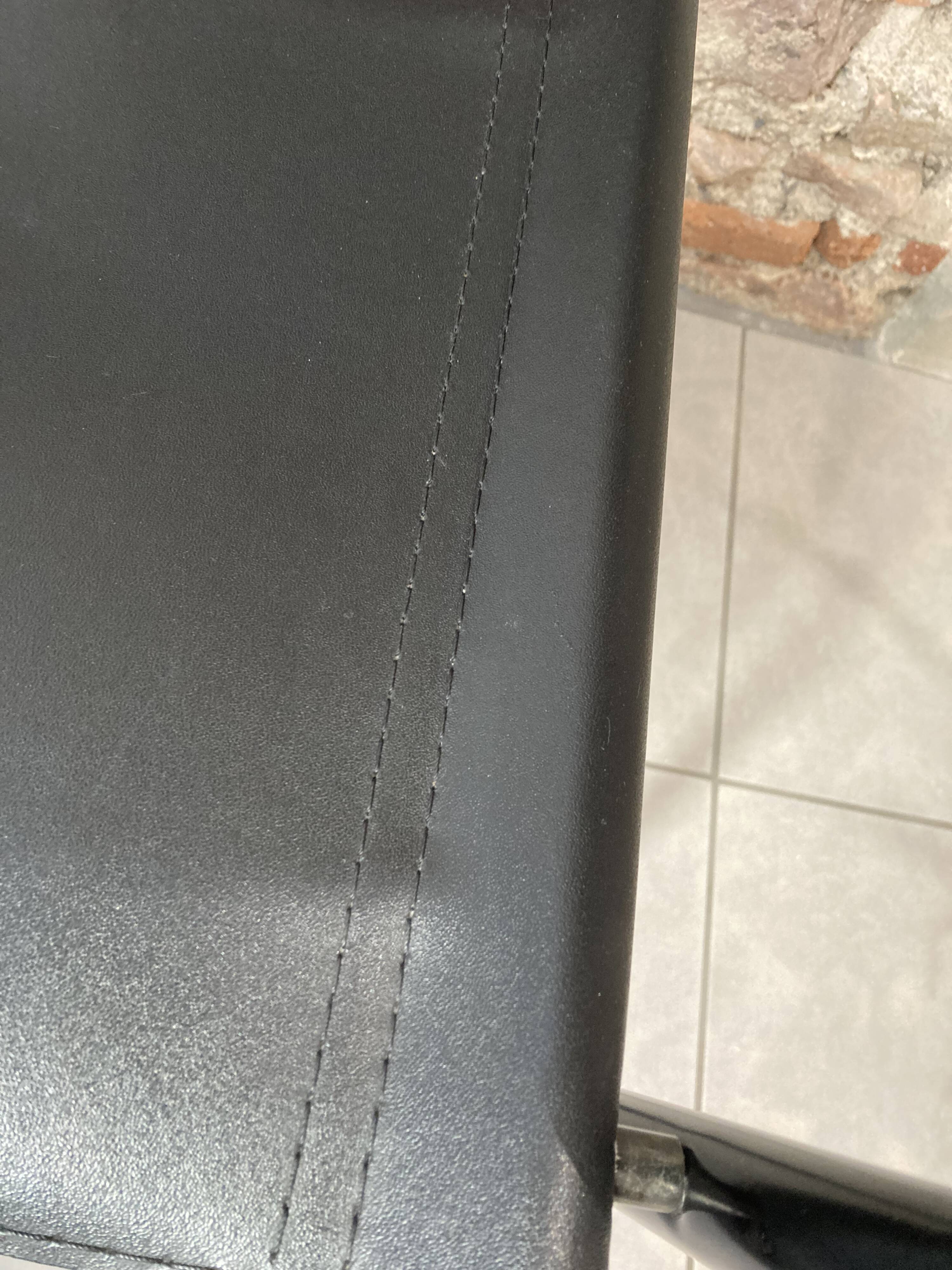 Armchair in black lacquered metal