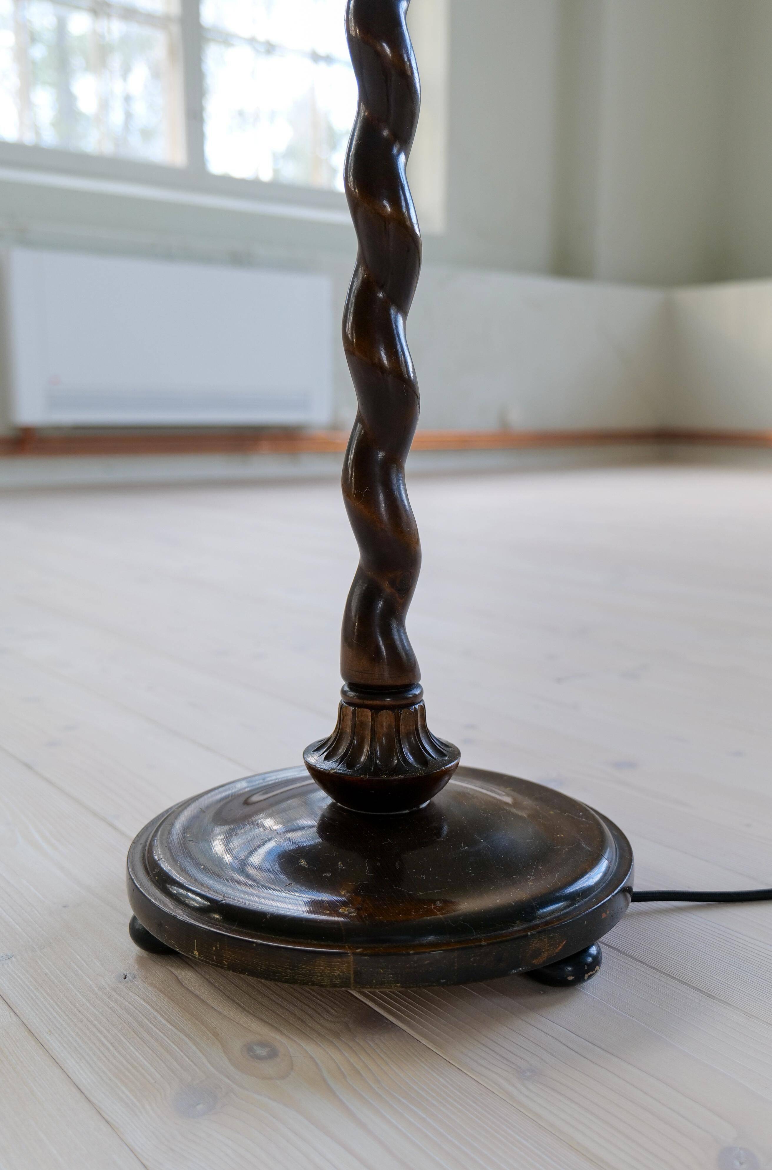 Organic whirlwind floor lamp in stained birch, Sweden, 1940s.