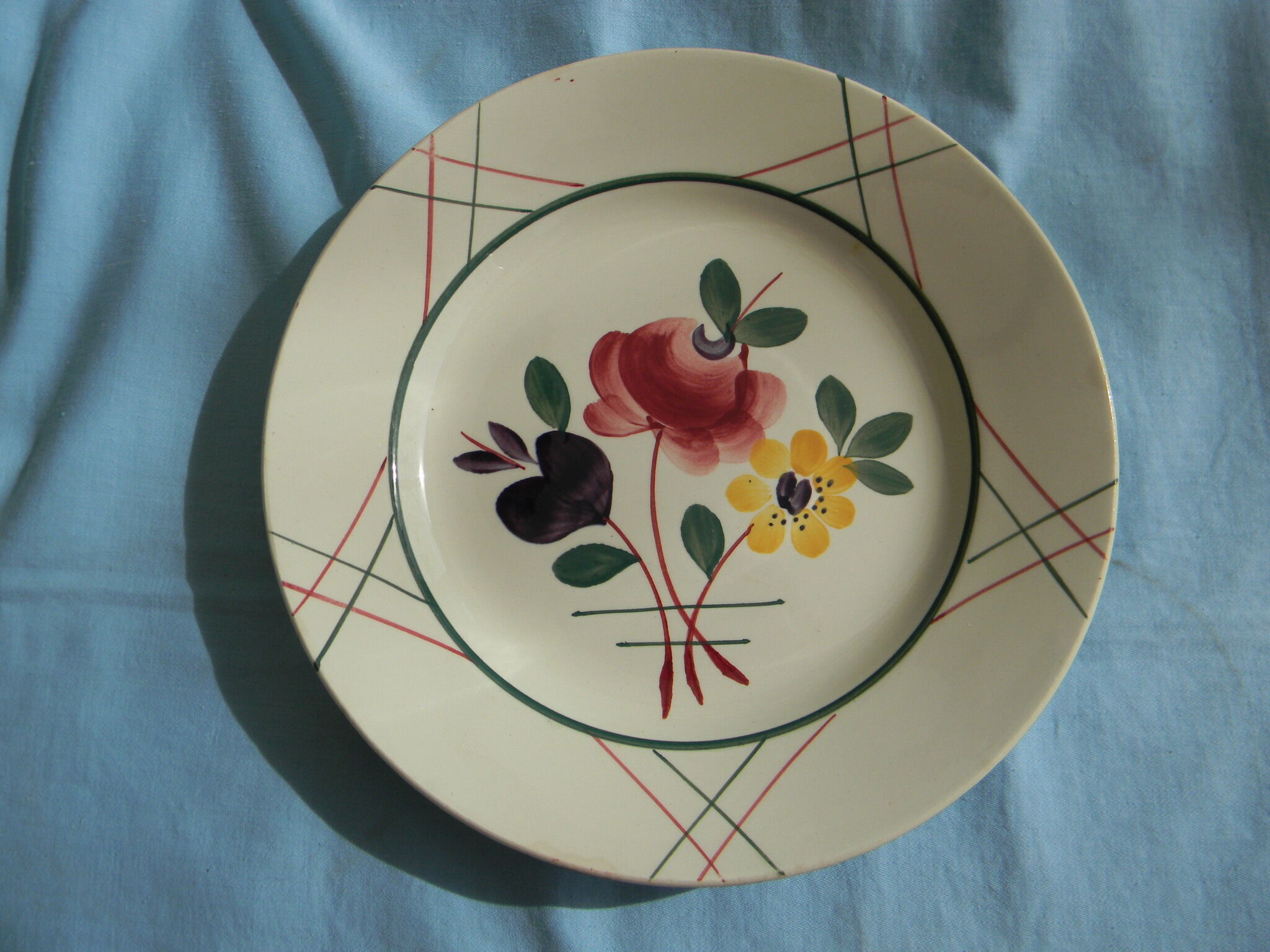 Miscellaneous set of 4 old flat earthenware plates.