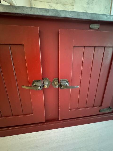 Low red "Guérande" buffet, zinc top, butcher's fridge-style doors