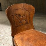 Set of 6 vintage solid wood chairs with animal motif on the back and leather seat