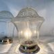 Pair of lantern-style ceiling lights or antique lamps.