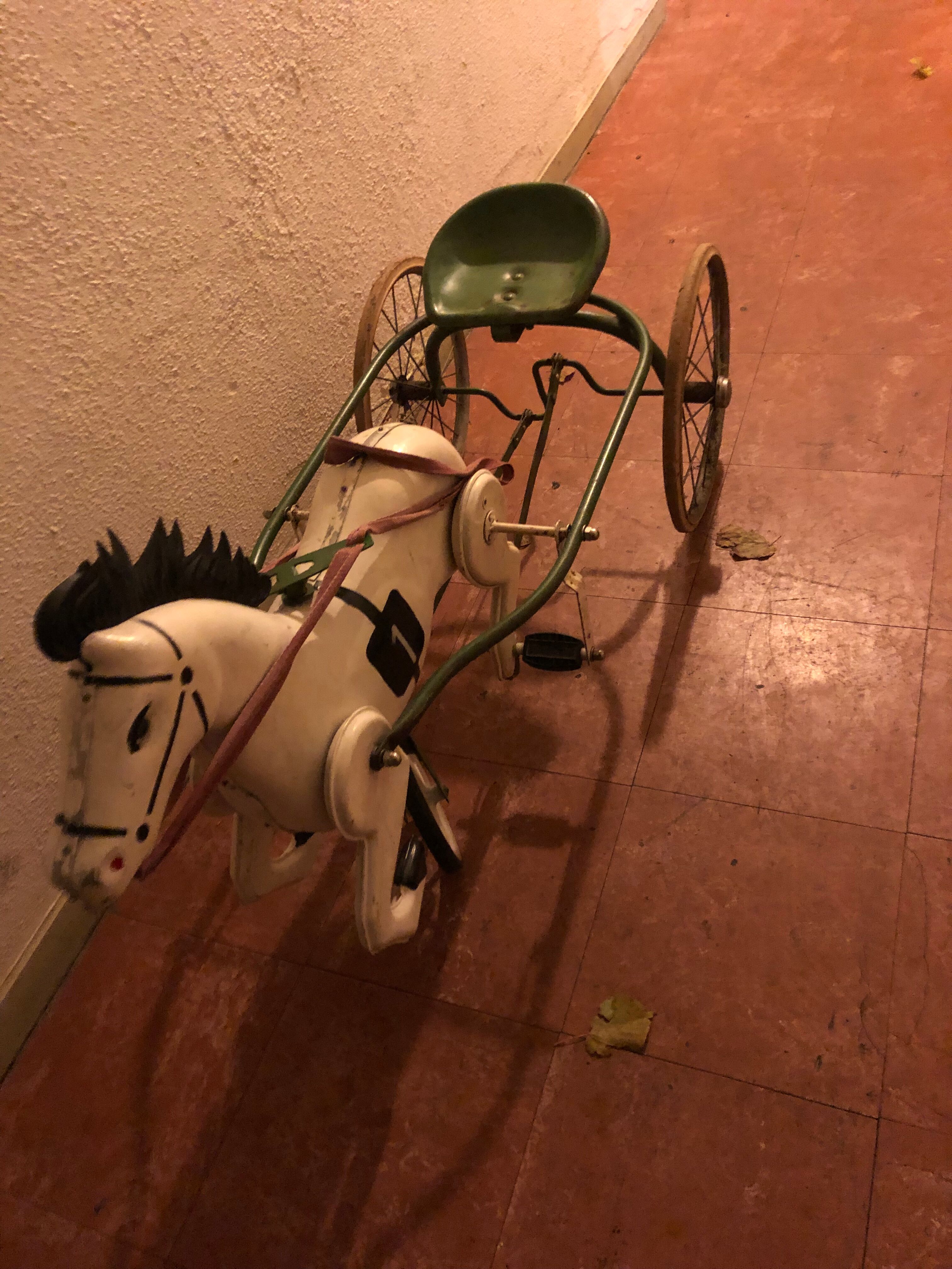 Old pedal horse with sulky