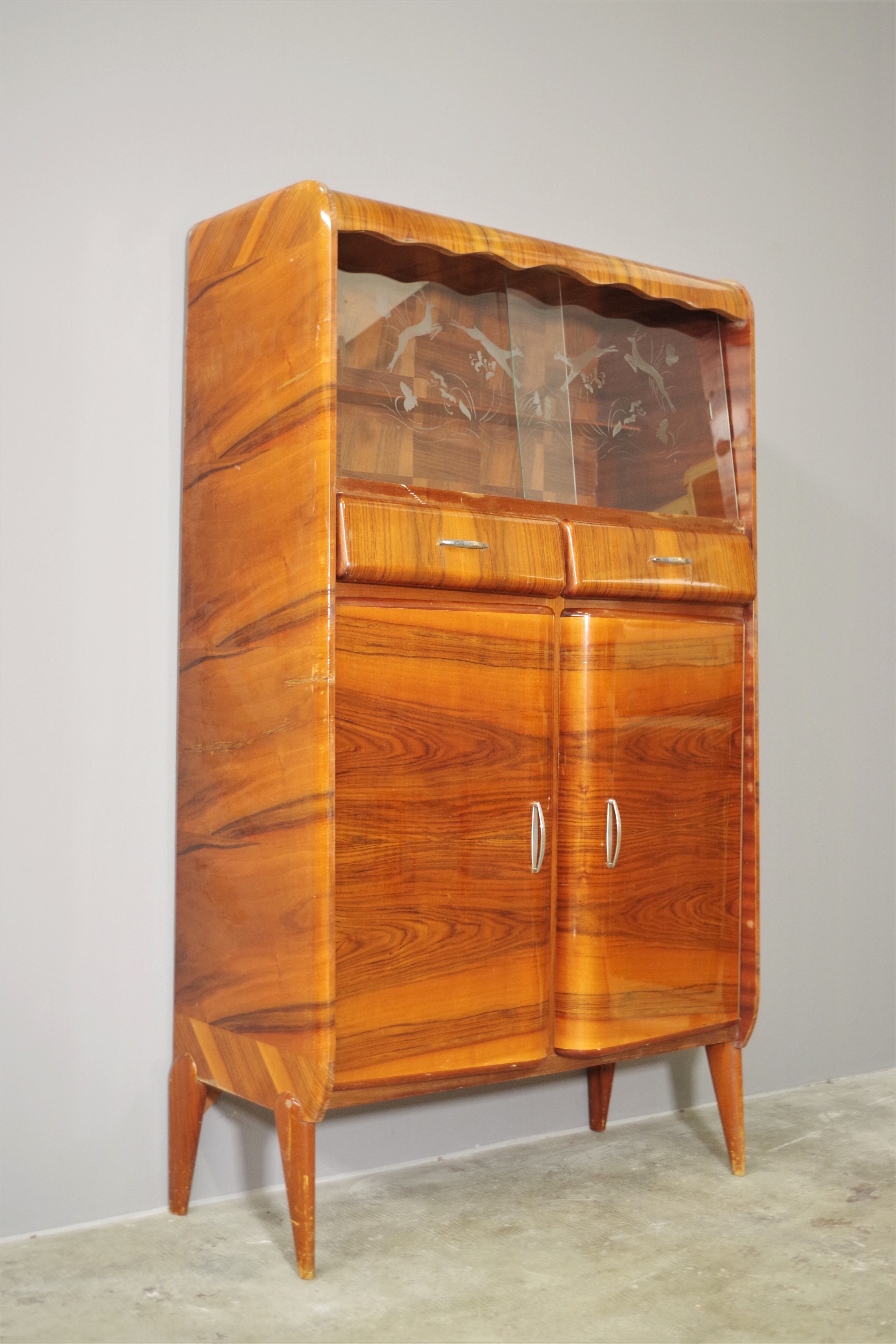 Rounded furniture from the 1950s in cherry veneer
