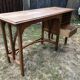 Old oak desk with curved wooden sleepers in the Art Nouveau spirit of the early 20th century.