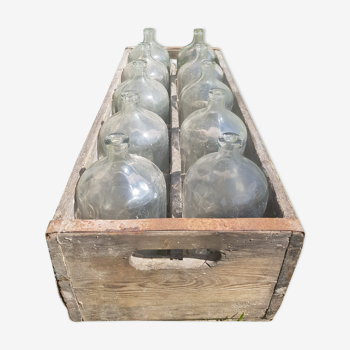 old wooden crate with 10 glass bottles