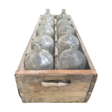old wooden crate with 10 glass bottles