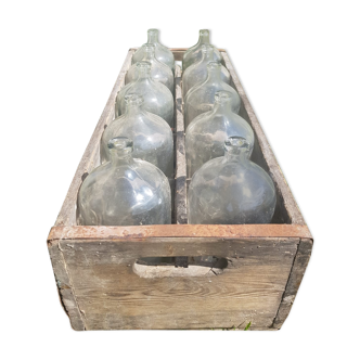 old wooden crate with 10 glass bottles