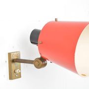 Old and rare Stilnovo wall light, red and black lacquered metal and brass With period label