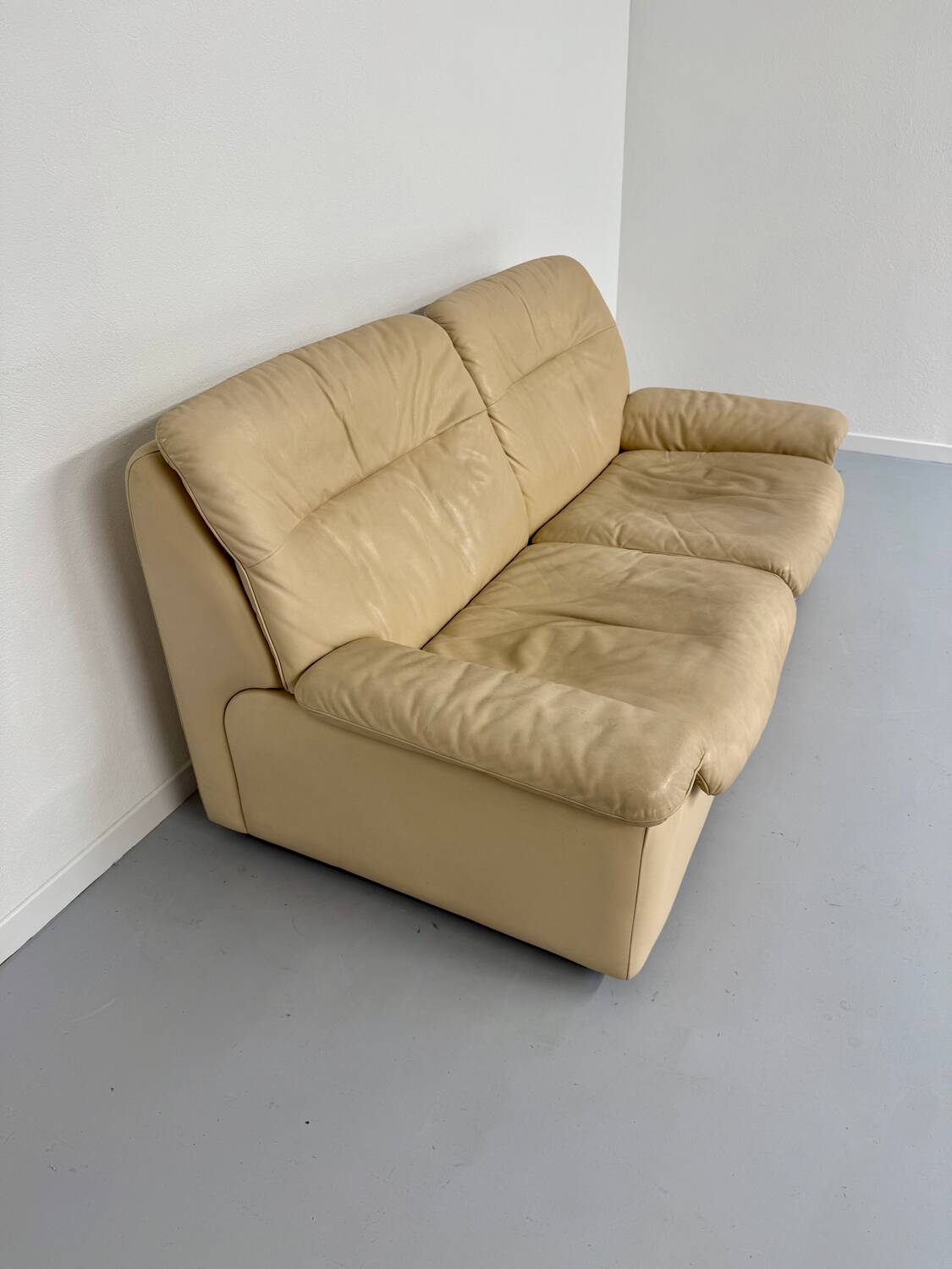 Old 2-seater beige leather sofa designed by Carl Larsson De Sede, vintage 80s