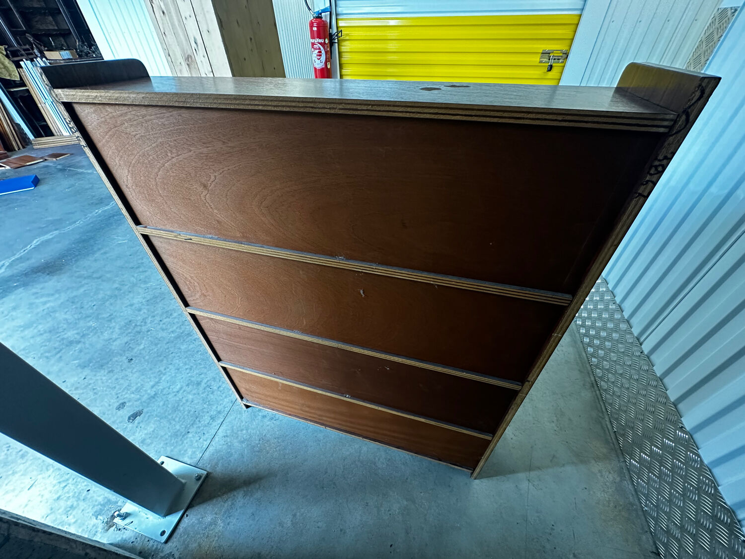 Vintage 1960s wooden library with sliding doors.