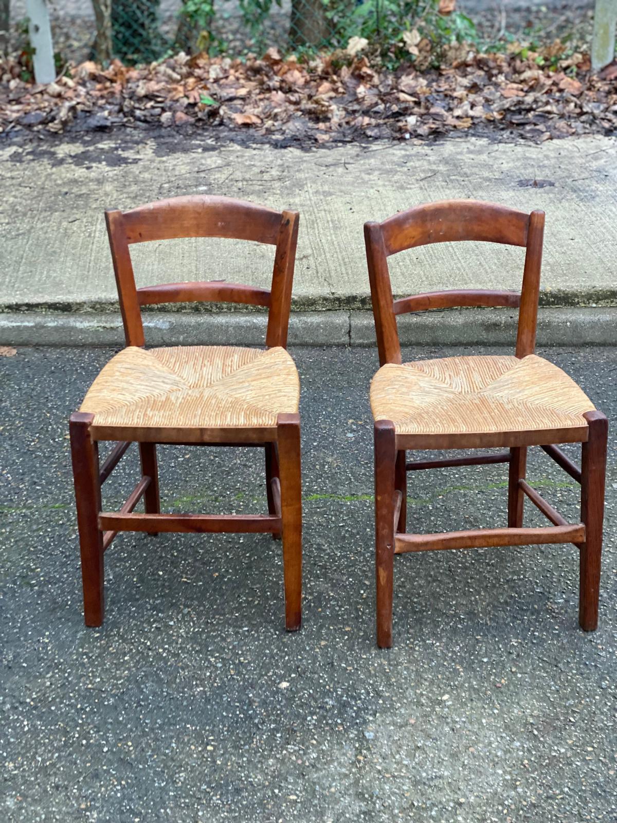 2 solid wood chairs with rush seats, child size.