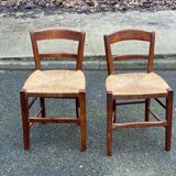 2 solid wood chairs with rush seats, child size.