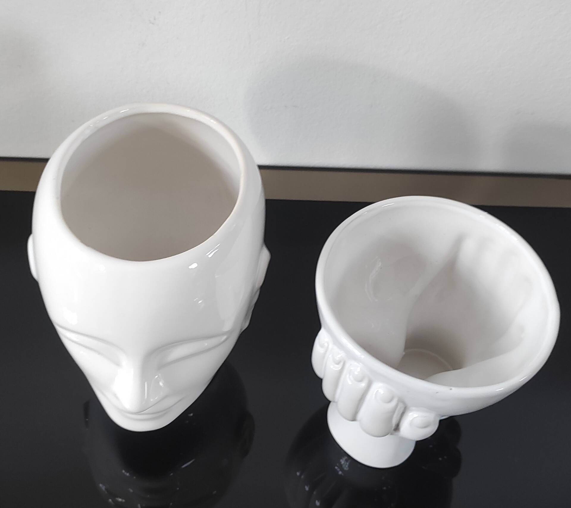 A pair of vintage ceramic plant pots.