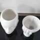A pair of vintage ceramic plant pots.
