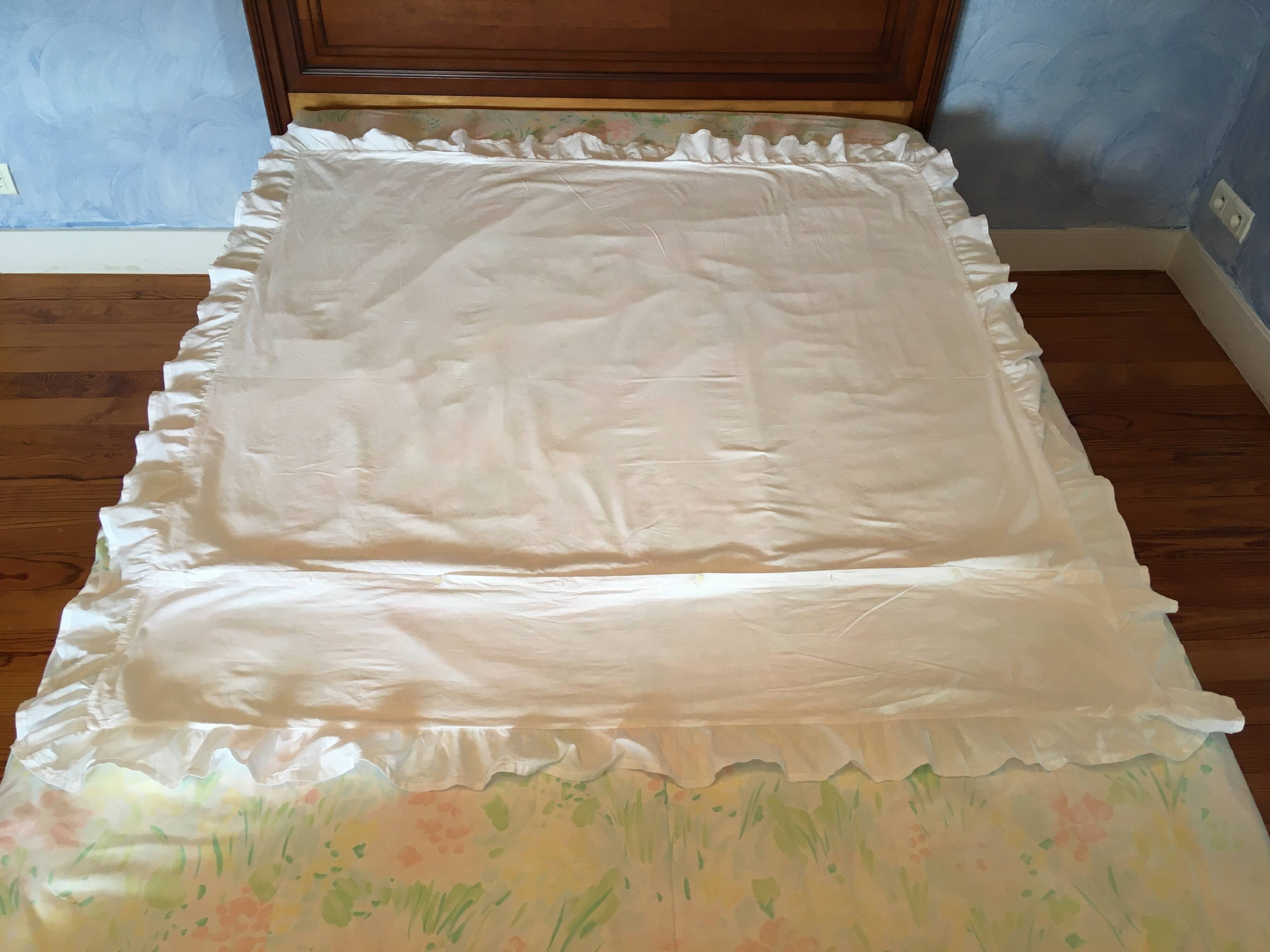 An antique embroidered duvet cover