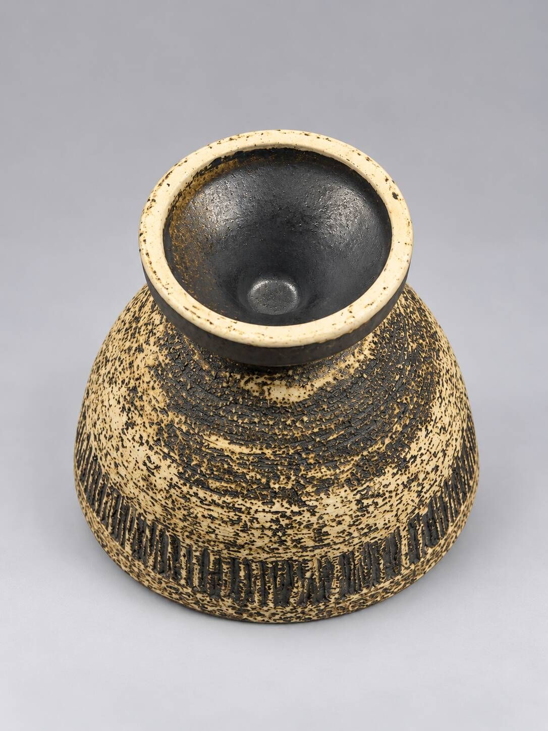 Vintage ceramic pedestal bowl – textured black and beige decor