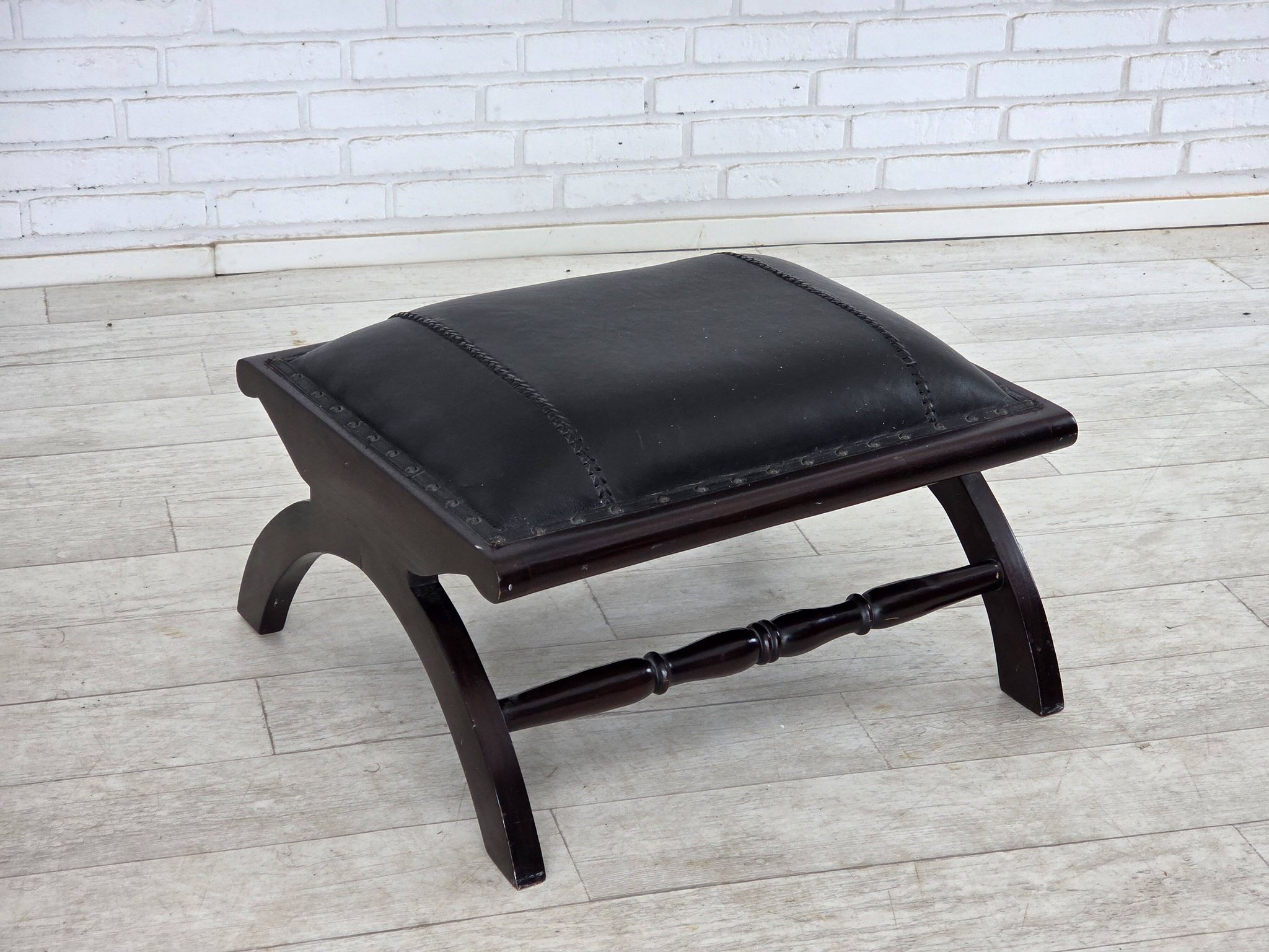 1970s, vintage armchair with footstool, black furniture leather.