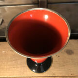 Cut vase on foot in red and black metal
