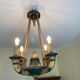 Empire style chandelier with four lights in sheet metal, bronze with patina and gilding