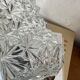 Swan neck wall light in stainless steel, thick glass shade, stainless steel rose.