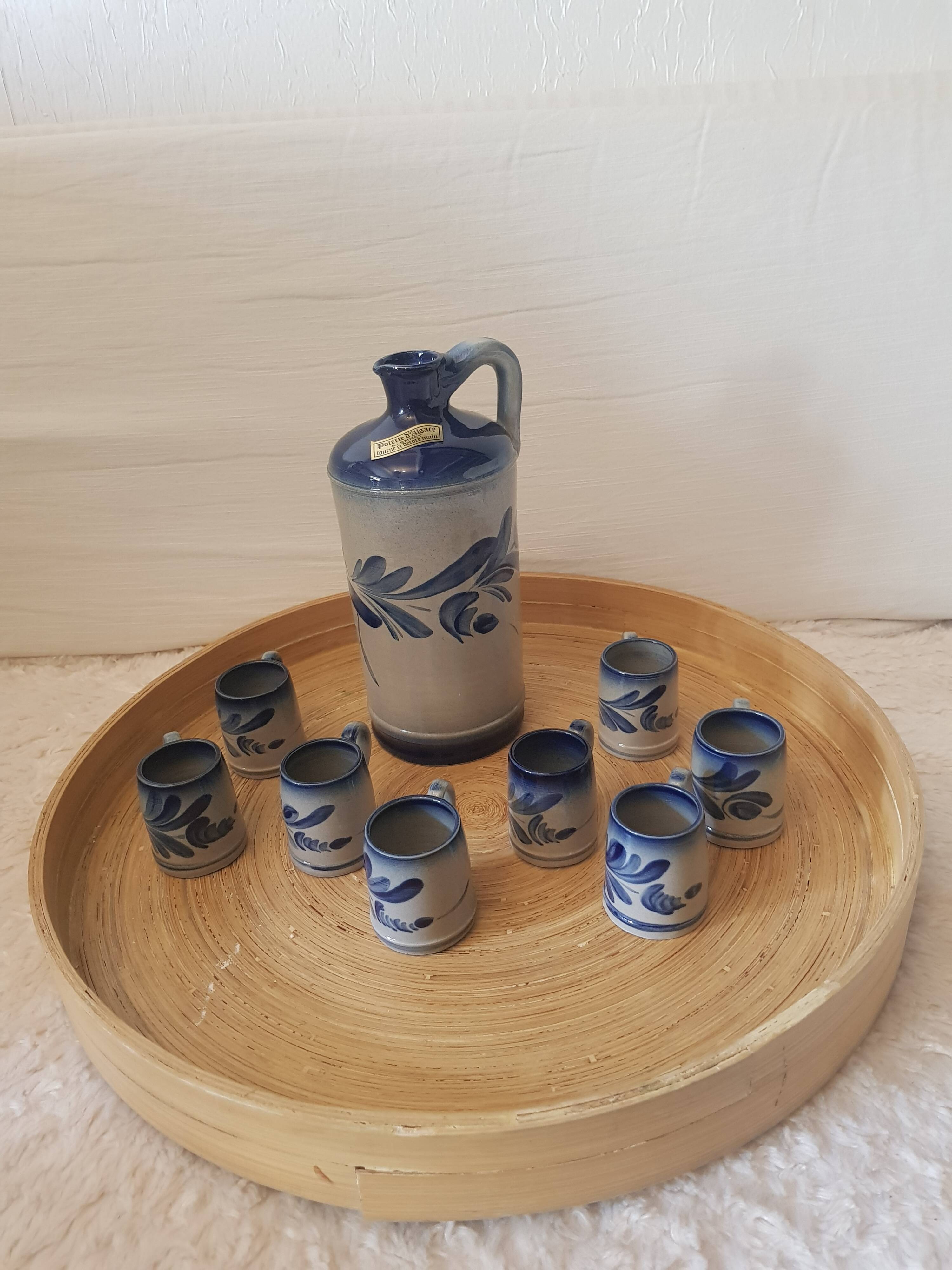 Pitcher and 8 mugs signed Anne Ehret in Alsace stoneware