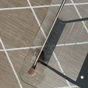 Metal and glass coffee table with magazine rack by Roche Bobois from the 1950s.