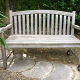 Vintage wooden garden bench with wheels