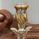 A pair of candlesticks. silver metal with gold decoration.