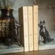 Pair of Art Deco bookends to signed wolf dogs