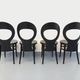 Set of 4 vintage Mouette chairs by Baumann in black wood from the 1960s.