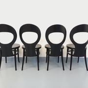 Set of 4 vintage Mouette chairs by Baumann in black wood from the 1960s.