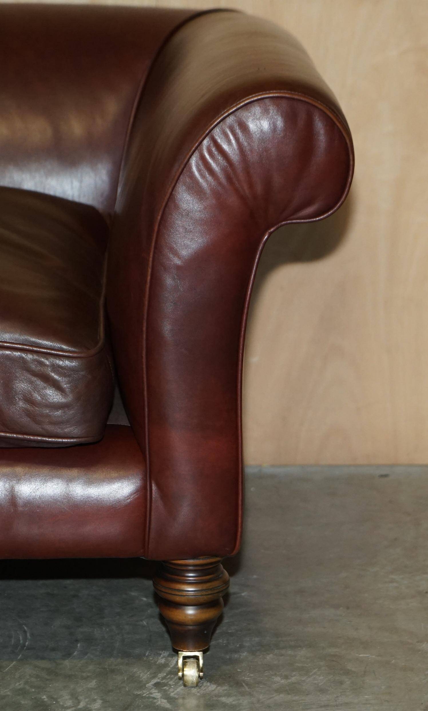 Vintage Art Deco leather sofa, three-seater, feather cushions.