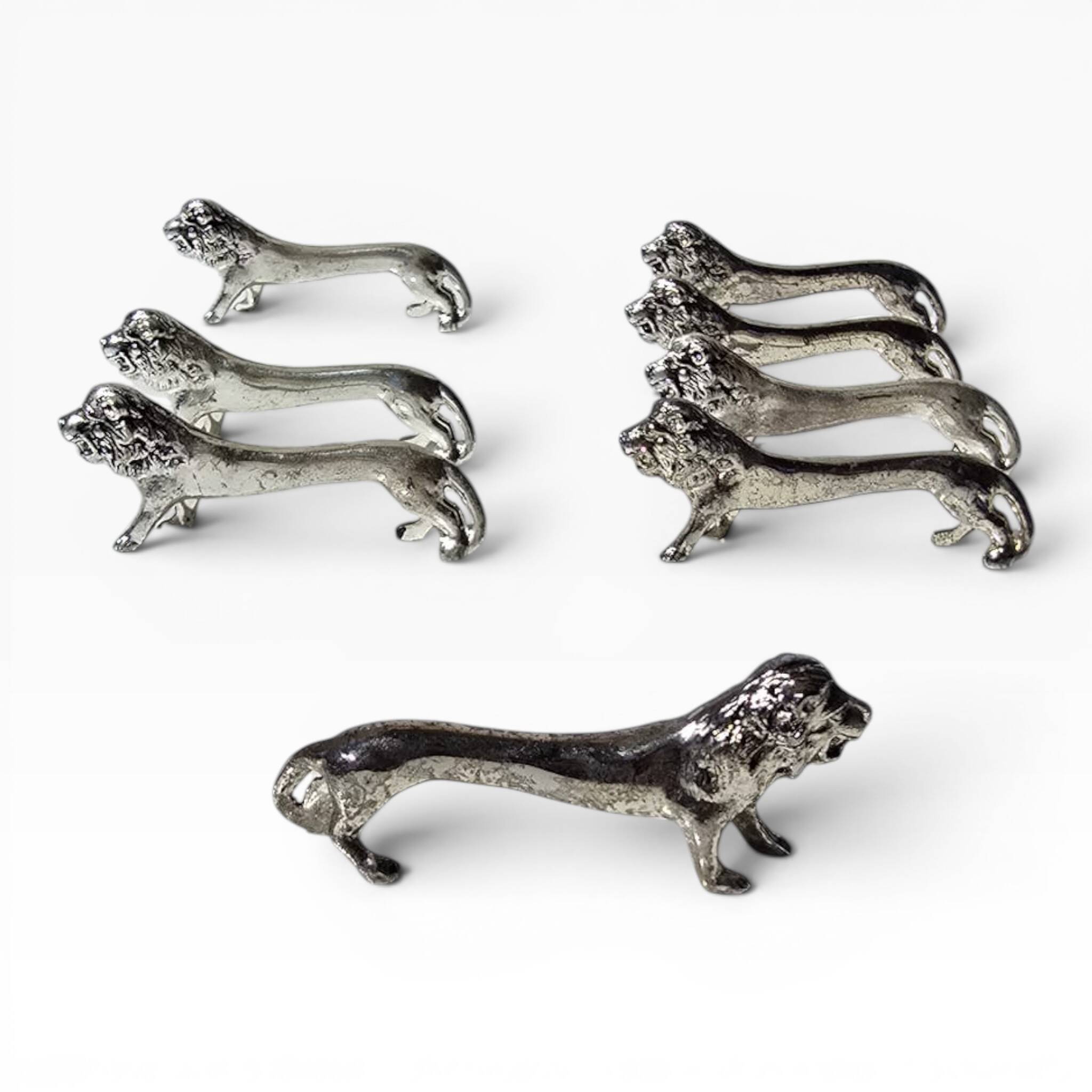 Series of antique knife rests in the shape of a lion, silver-plated metal.