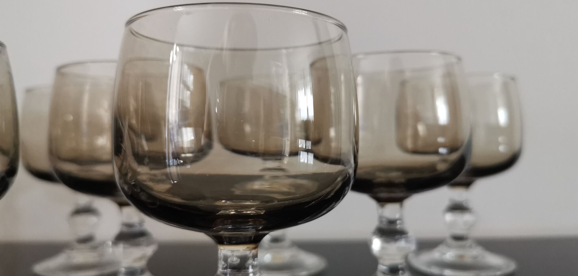 9 glasses of white wine on vintage stand Luminarc Smoked Black