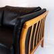 Two seater sofa upholstered with black leather and of danish design