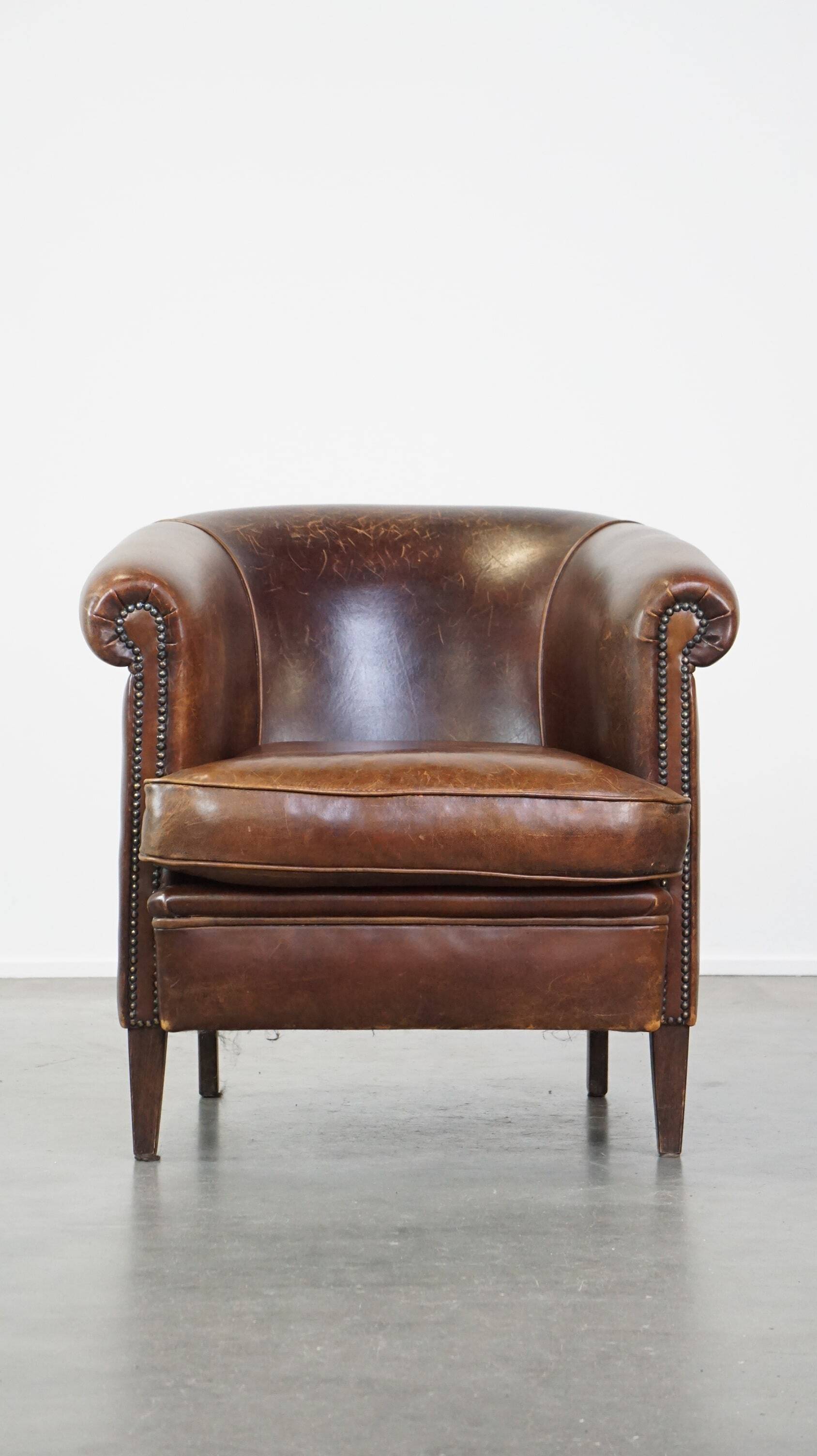 English style sheep leather club chair finished with decorative nails