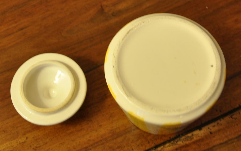 Yellow and white striped cover pot