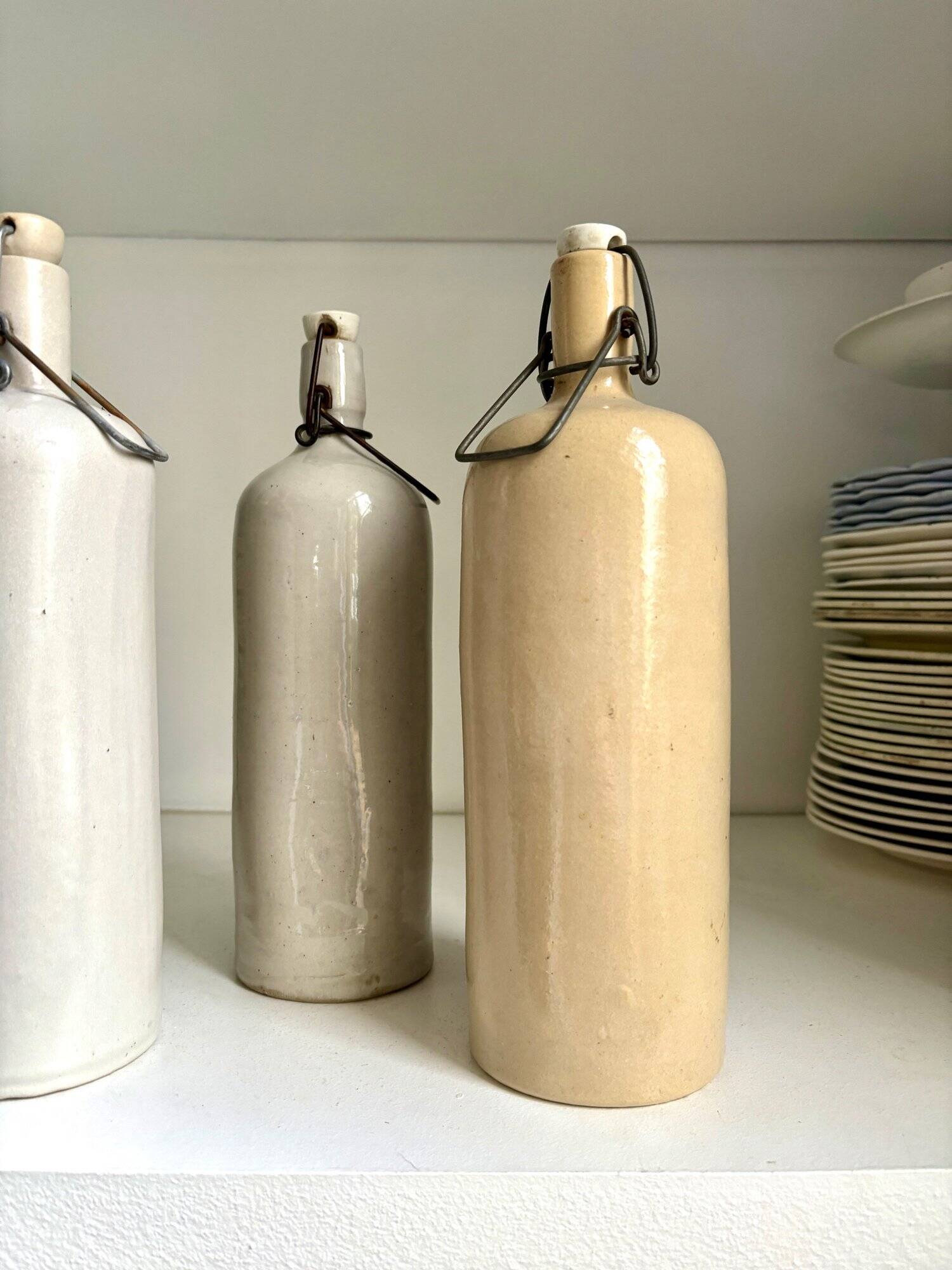 4 beige glazed stoneware bottles