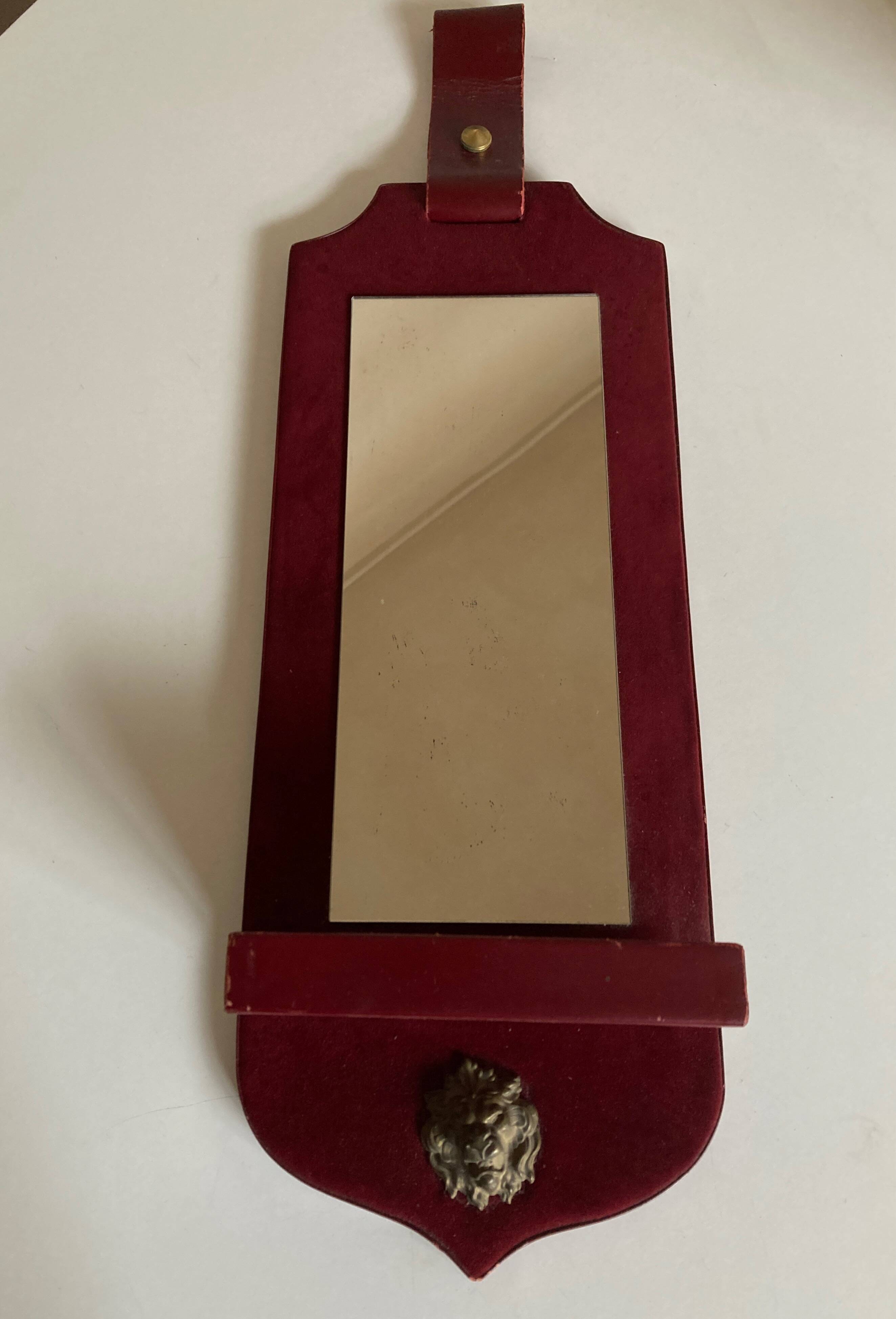 1960 cloakroom mirror with leather and brass shelf