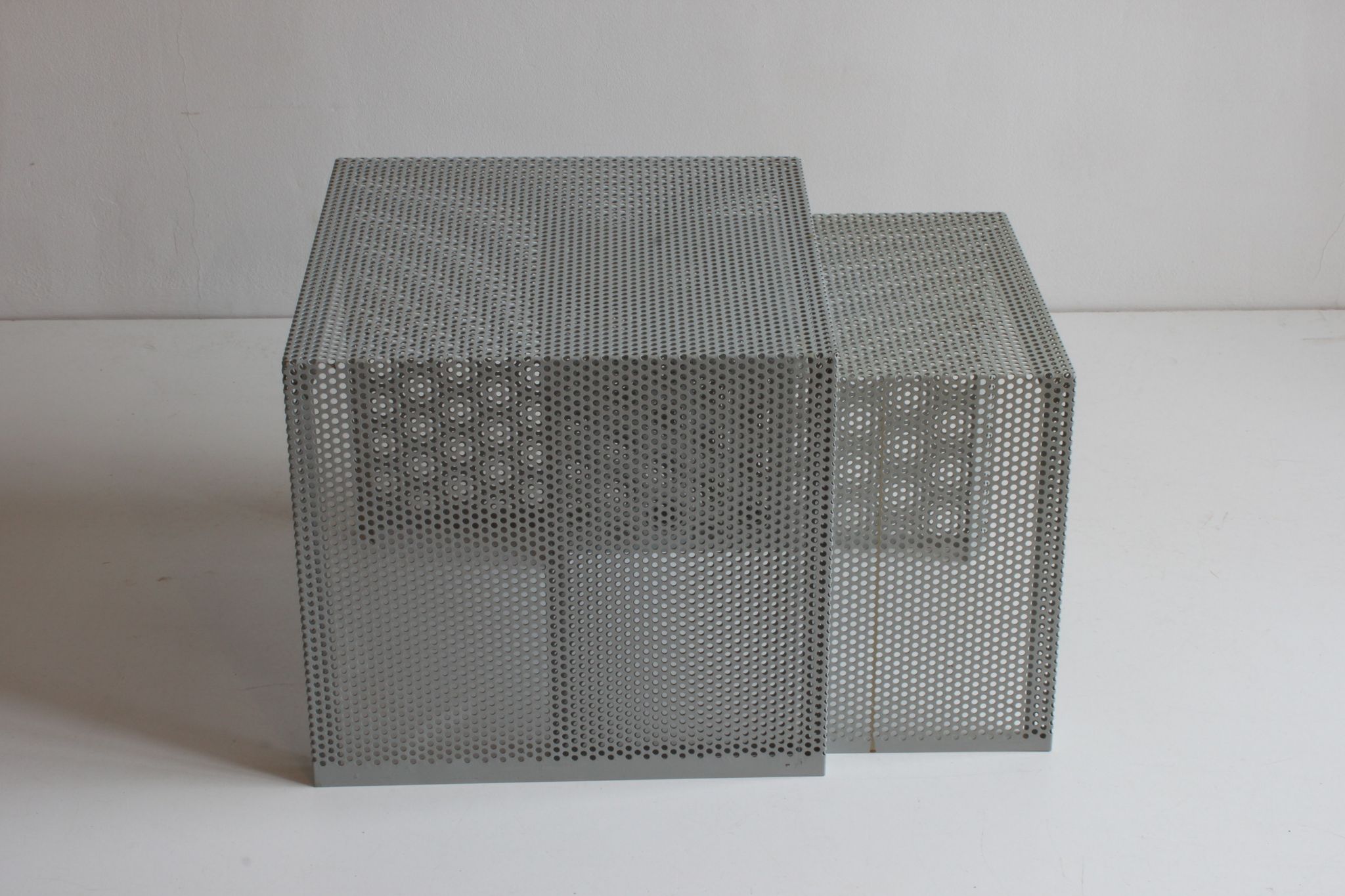 Grey perforated metal nesting side tables, 1990s set of two.
