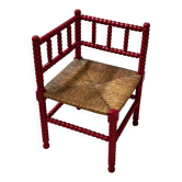 Red turned wood corner chair with rush seating