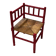 Red turned wood corner chair with rush seating