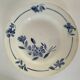 Set of 8 ironstone plates with coordinated designs.
