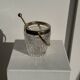 Small golden glass ice bucket with diamond point design and its scoop.