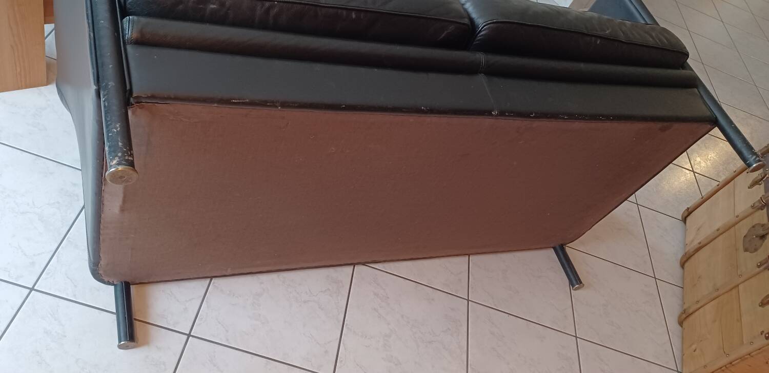 Black leather two-seater sofa