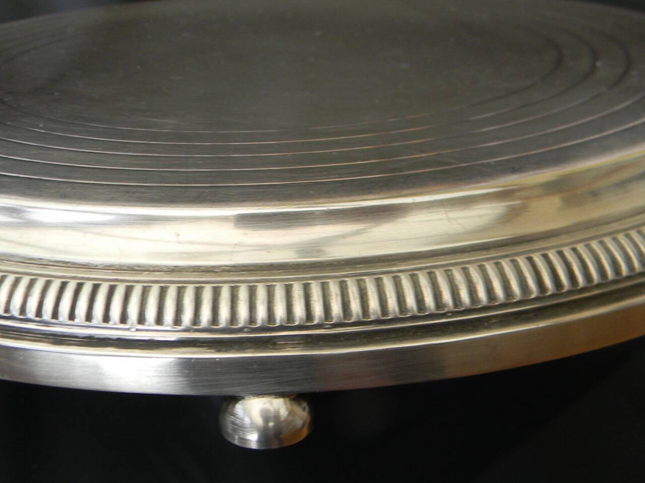 Silver-plated trivet.